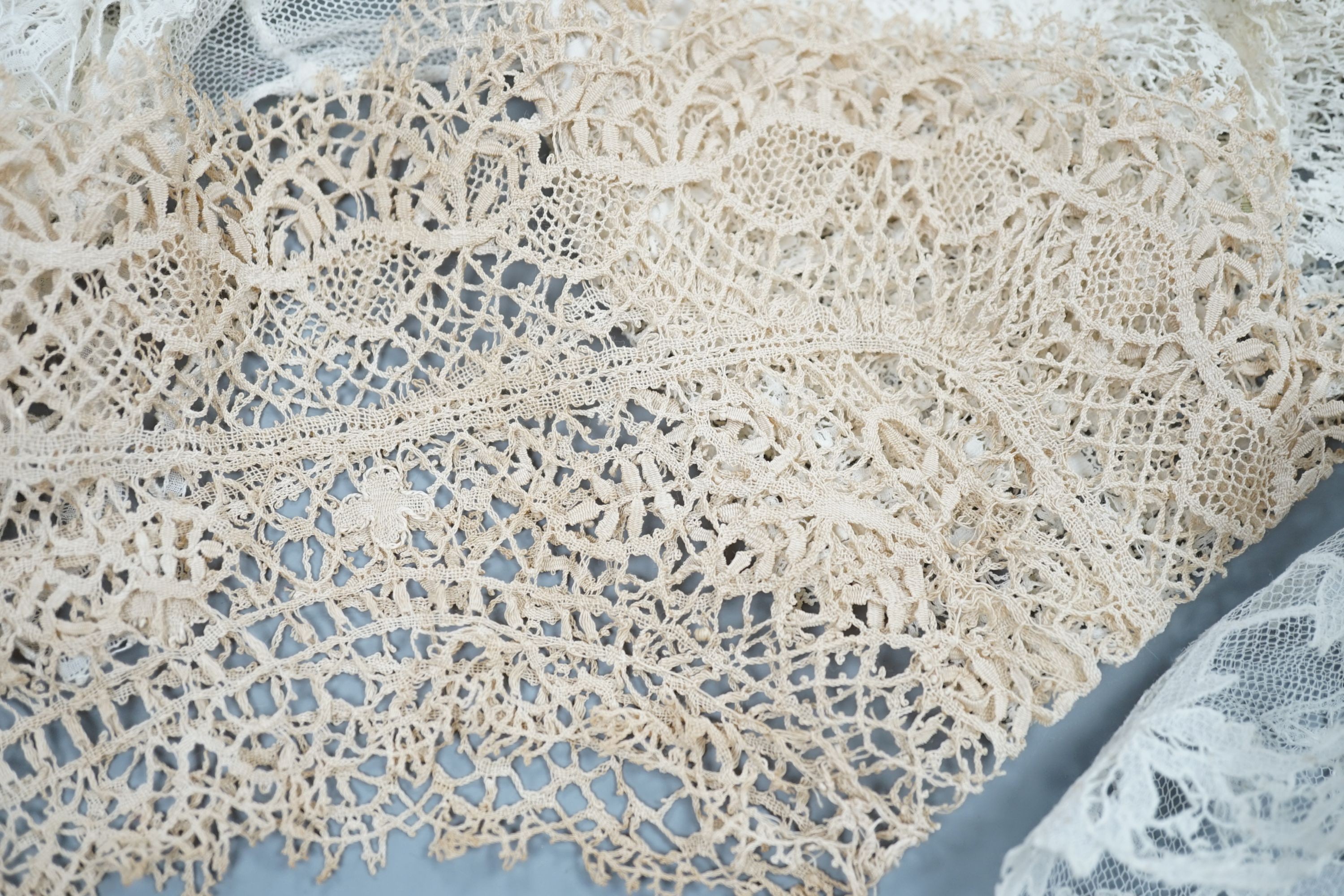A collection of 19th century hand made bobbin lace and other handmade collars and trimmings, including Honiton, Irish crochet.